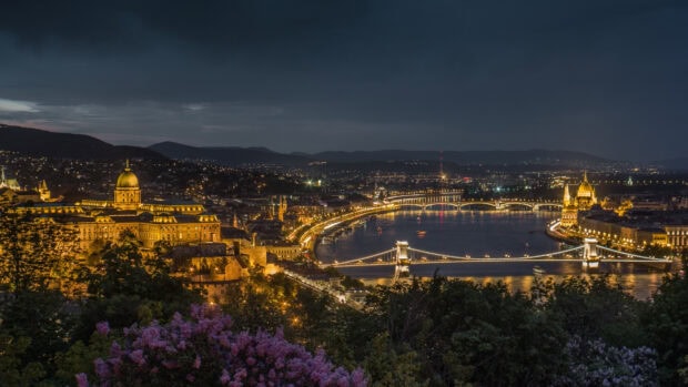 Night view of Budapest cityscape with the Danube river and historical buildings illuminated