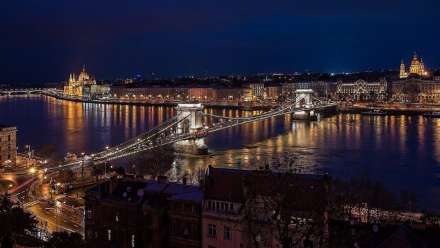 The historic Budapest cityscape showcasing the illuminated Chain Bridge and Parliament at night