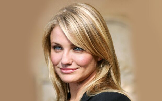 Cameron Diaz with blonde hair smiling softly in natural light