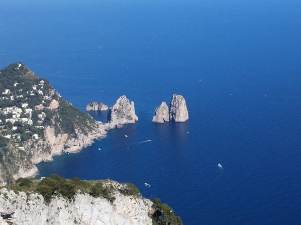 Aerial view of Capri Island with rocky cliffs and clear blue sea