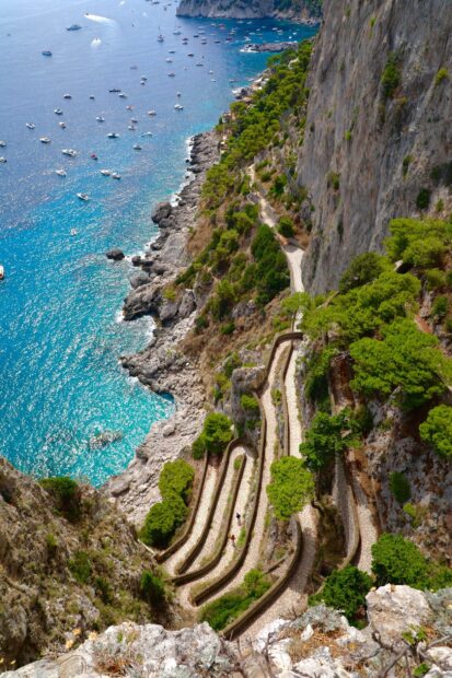 Scenic winding path on Capri Island surrounded by cliffs and turquoise sea