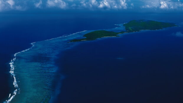 Aerial view of Caribbean islands surrounded by deep blue ocean and coral reefs