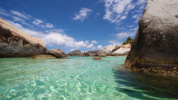 Clear turquoise water around large rocks on Caribbean Islands