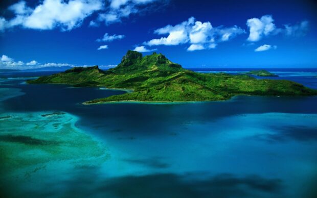 A stunning Caribbean Islands landscape with lush greenery and clear blue waters under a bright sky