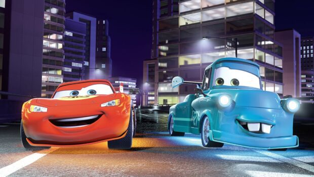 Red and blue animated Cars Disney characters smiling on city street at night