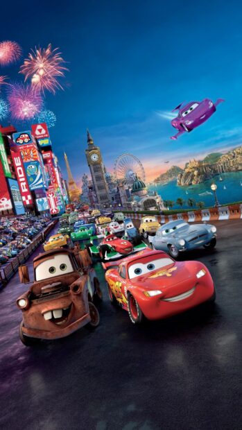 Animated cars from Cars Disney racing on a city street with famous landmarks and fireworks in the sky