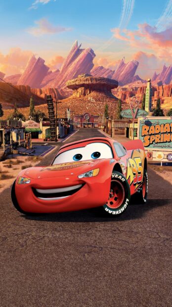 Lightning McQueen from Cars Disney in Radiator Springs with scenic mountain background