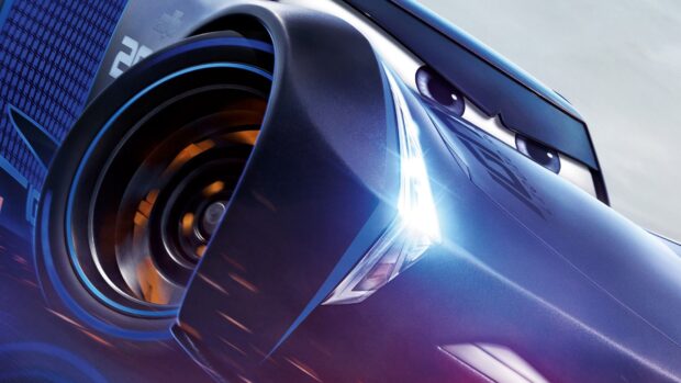 Close up of a cars character with blue paint and focused eyes speeding on the track