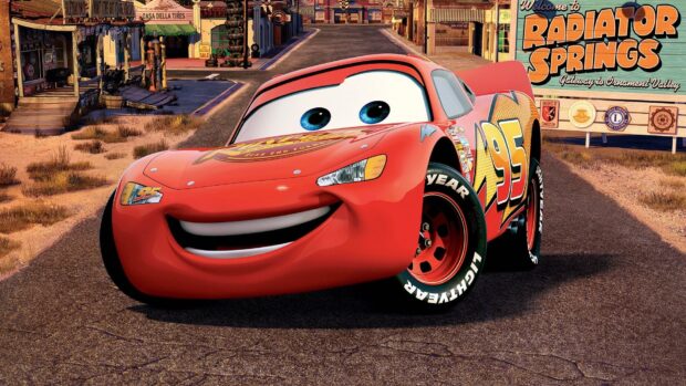 Red cars character from Cars Disney is smiling on the road of Radiator Springs
