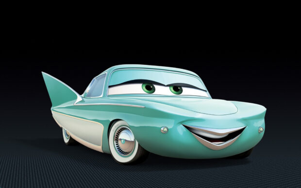 A classic Cars Disney character with green eyes smiles on a turquoise vintage car