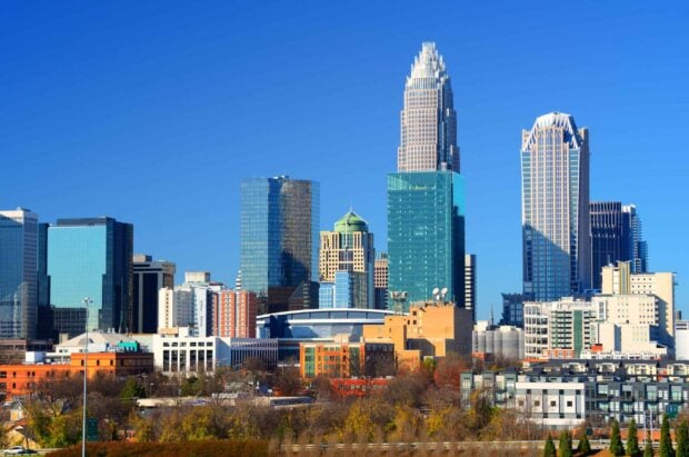 Charlotte skyline featuring modern skyscrapers under clear blue sky