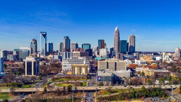 A clear view of Charlotte skyline with tall buildings and blue sky in high definition quality