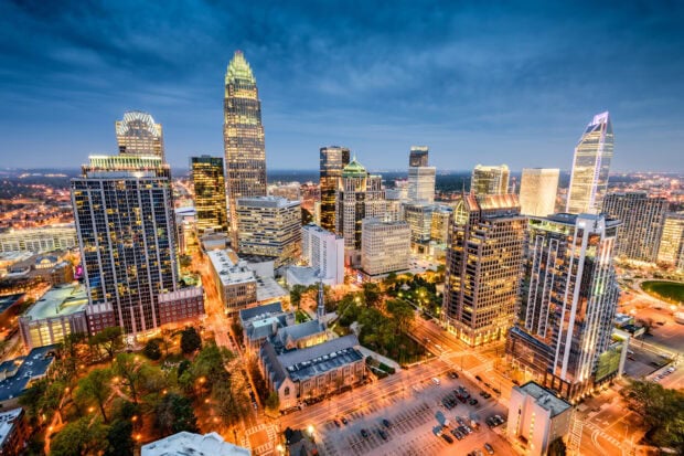Charlotte Skyline Wallpapers HD Desktop Charlotte city skyline featuring tall buildings and illuminated streets at dusk