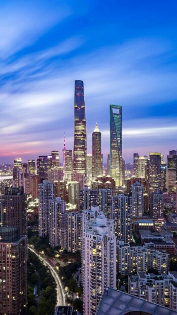 Modern cityscape showcasing China skyscrapers under a colorful evening sky