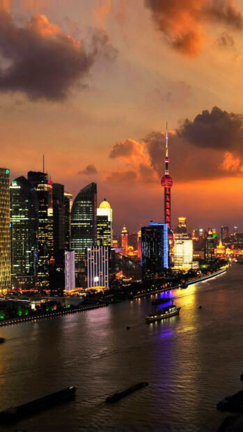 The impressive China cityscape with illuminated buildings and a vibrant sunset sky