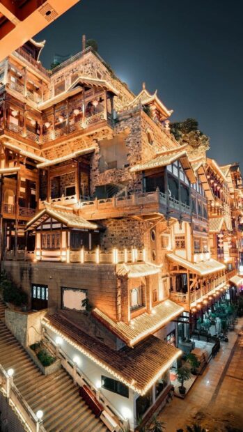 Traditional Chinese architecture with illuminated rooftops at night