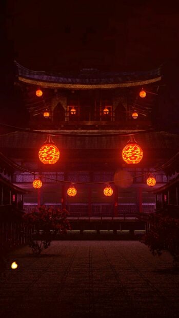 Traditional Chinese lanterns glowing at night in a historic building courtyard