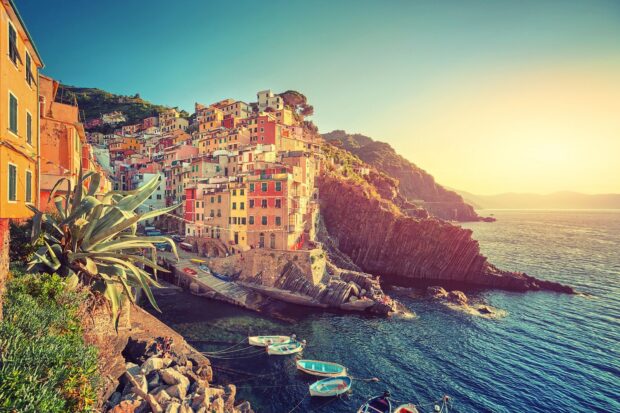 Colorful Cinque Terre village houses on the coast during sunset