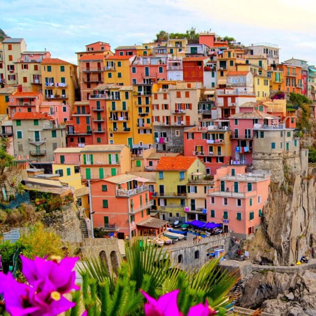Colorful Cinque Terre coastal village with vibrant buildings and blooming flowers
