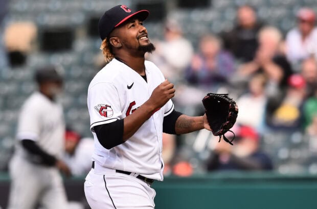 Cleveland Guardians player smiling on the field during a baseball game