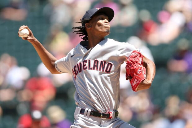 Cleveland pitcher in Cleveland uniform throwing a baseball during a game