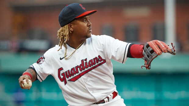 A Cleveland Guardians player preparing to throw a baseball during the game