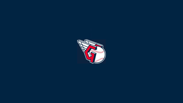 Cleveland Guardians logo with a winged baseball on a dark blue background showing Cleveland Guardians