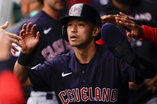 A Cleveland Guardians player wearing a helmet and jersey during a baseball game