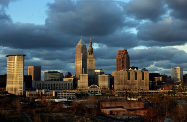 The Cleveland skyline at sunset with dramatic clouds and tall buildings in view
