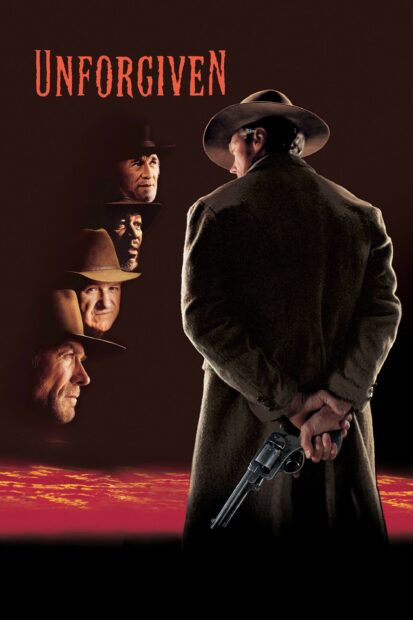 Clint Eastwood holding a revolver behind his back in a western setting with faces of other men in hats