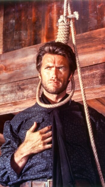 Clint Eastwood with a rope noose around his neck in a western setting