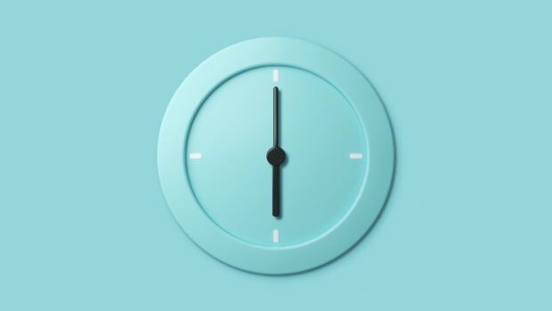 Minimalist clock with black hands on a light blue background showing twelve o'clock