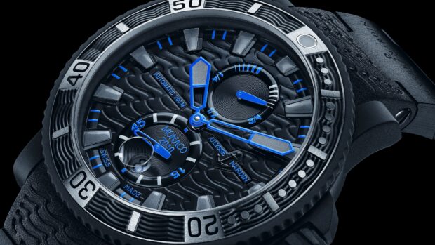 A close up view of a mechanical watch with blue accents and detailed craftsmanship