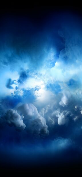 Swirling blue clouds form a misty abstract pattern in the sky