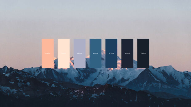 A color palette overlay with pastel and dark tones on a mountain landscape