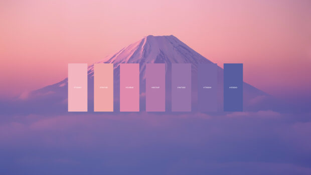 A color palette featuring soft pink and purple shades displayed over a mountain landscape