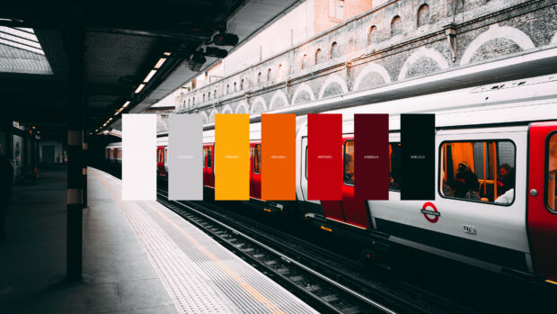 Color palette featuring warm and neutral tones overlaying a train station platform scene