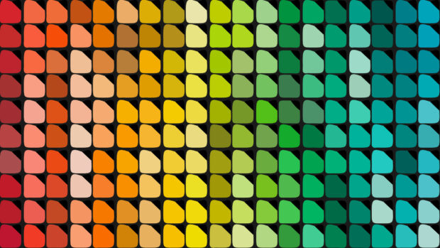 A colorful palette showcasing a wide range of warm to cool color swatches arranged in rows on black background