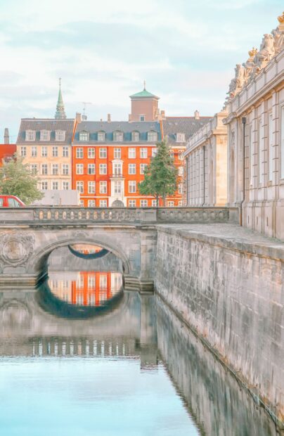 Historic architecture in Copenhagen reflected in calm canal water