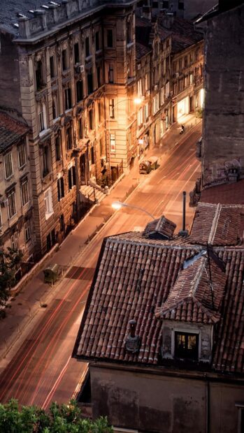 Evening cityscape with historic buildings in Croatia capturing light trails and street details