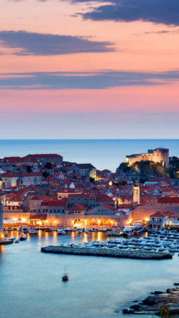 Old town of Croatia overlooking the Adriatic Sea at sunset showcasing historic architecture
