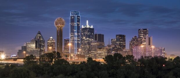 Dallas city skyline at night with illuminated buildings in Texas