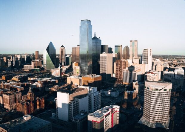 Downtown Dallas Texas skyline with tall buildings under clear sky