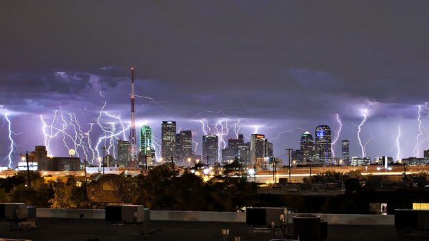 Lightning storm over Dallas Texas city skyline at night