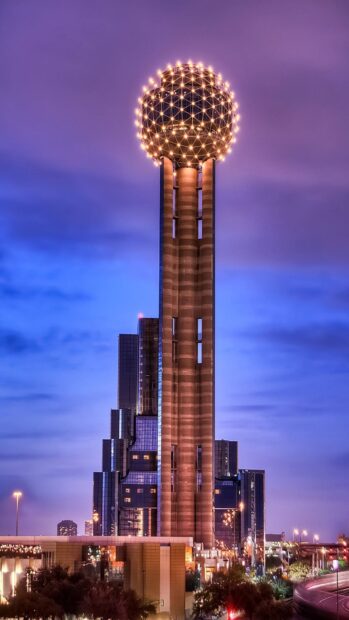 The iconic Reunion Tower structure stands tall in Dallas Texas during twilight
