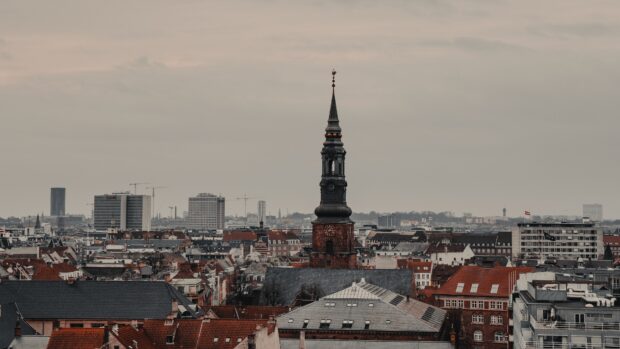 Historic Copenhagen cityscape with old town architecture and church tower in Denmark
