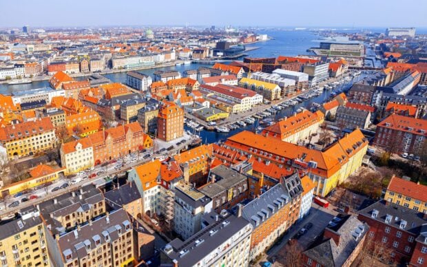 Aerial view of Denmark cityscape with colorful buildings and waterfront in bright daylight