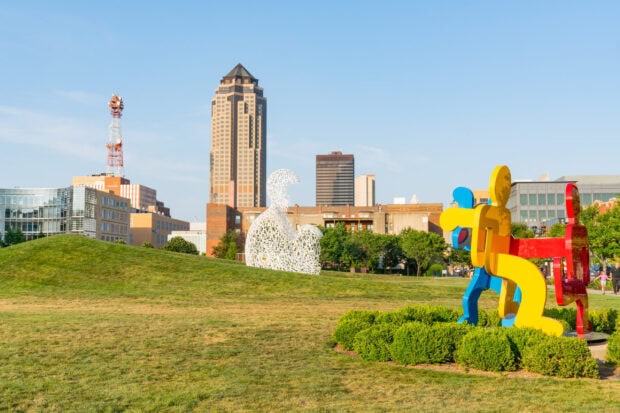 Colorful sculptures and cityscape of Des Moines in a green park
