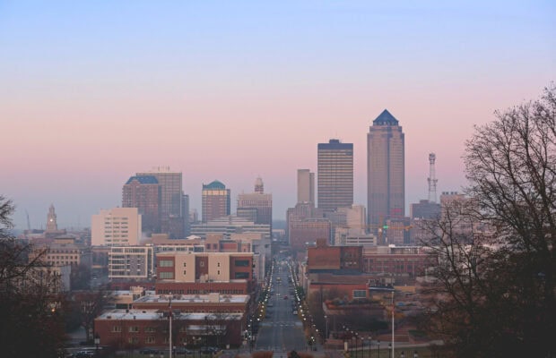 Downtown Des Moines cityscape with buildings and streets at sunset in Des Moines