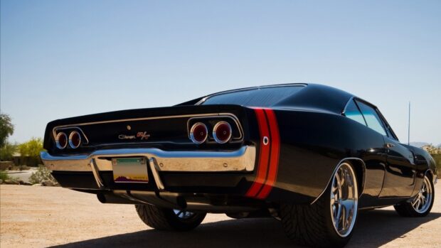Black Dodge Charger with red stripes parked under clear sky in Arizona desert